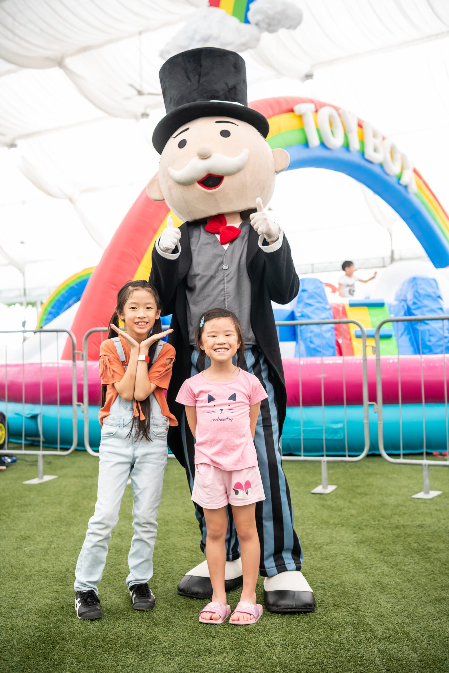 Mr. Monopoly mascot walks around the event meeting fans